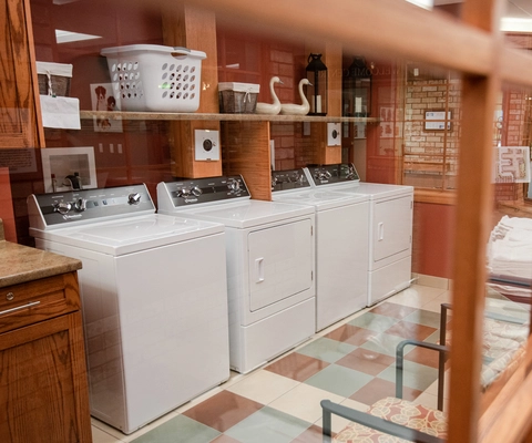 Laundry facility with washing machines and baskets