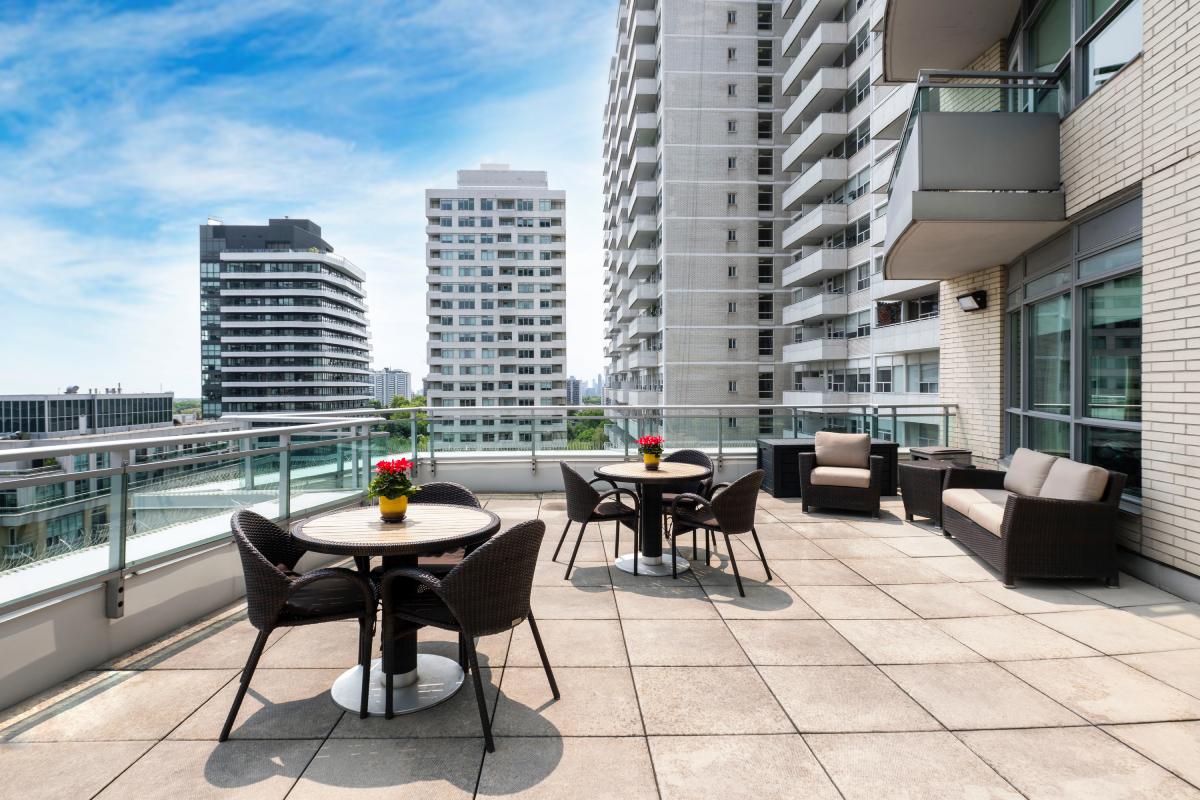 Outdoor patio with seating and views of buildings