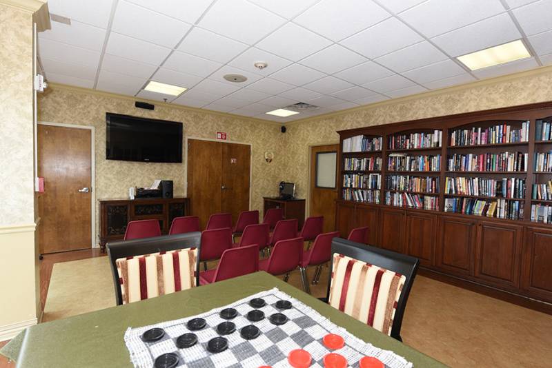 Common area with bookshelves and seating