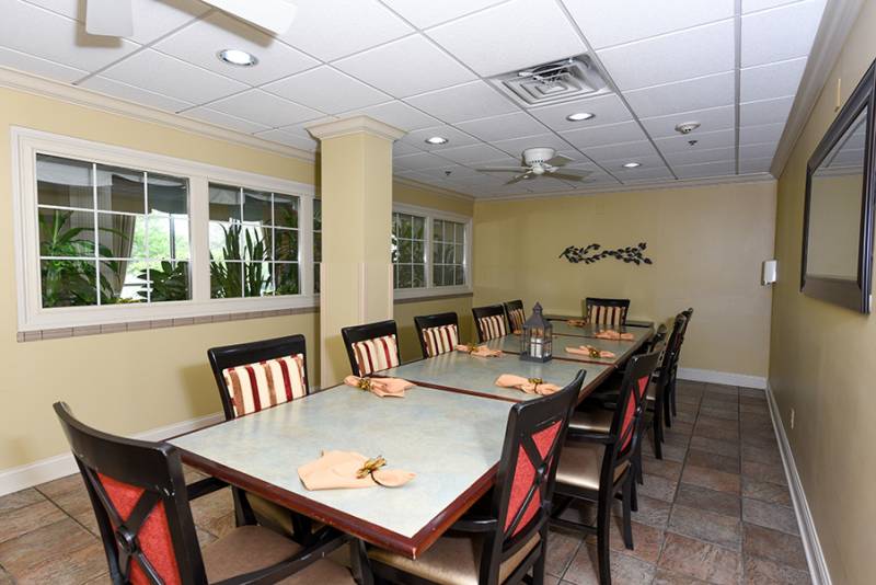 Dining area with tables and chairs.