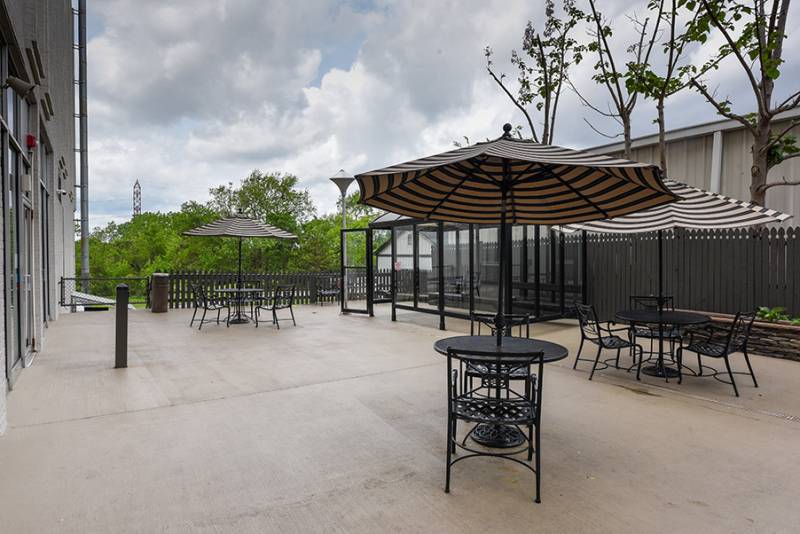 Outdoor patio with tables and umbrellas