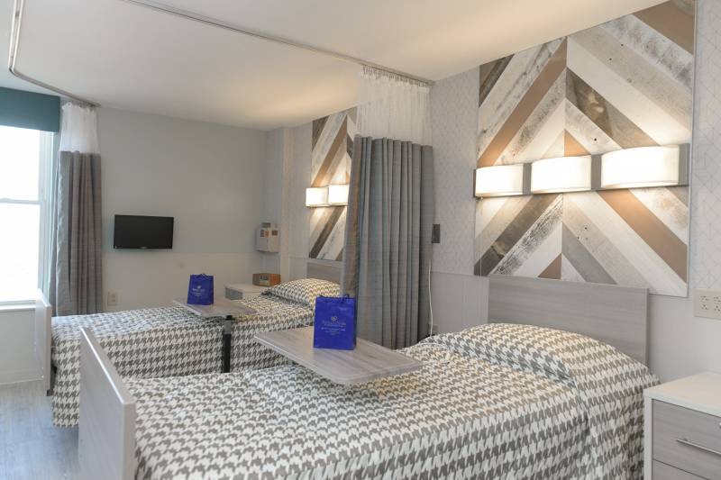 Bright and modern resident bedroom with two beds.