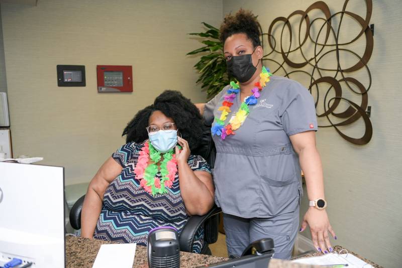 Staff and resident at reception during celebration