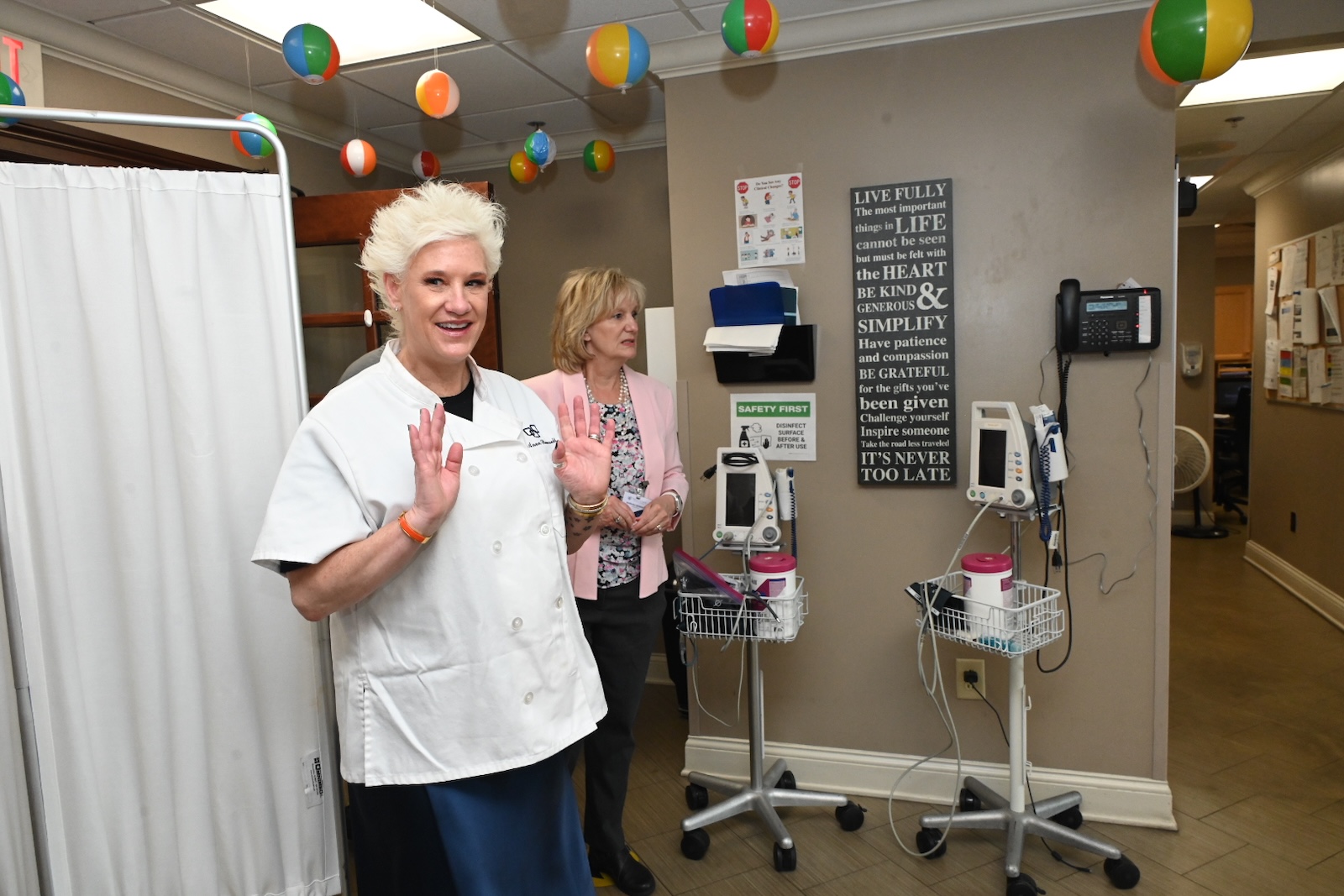 Staff members interacting in a welcoming facility space.