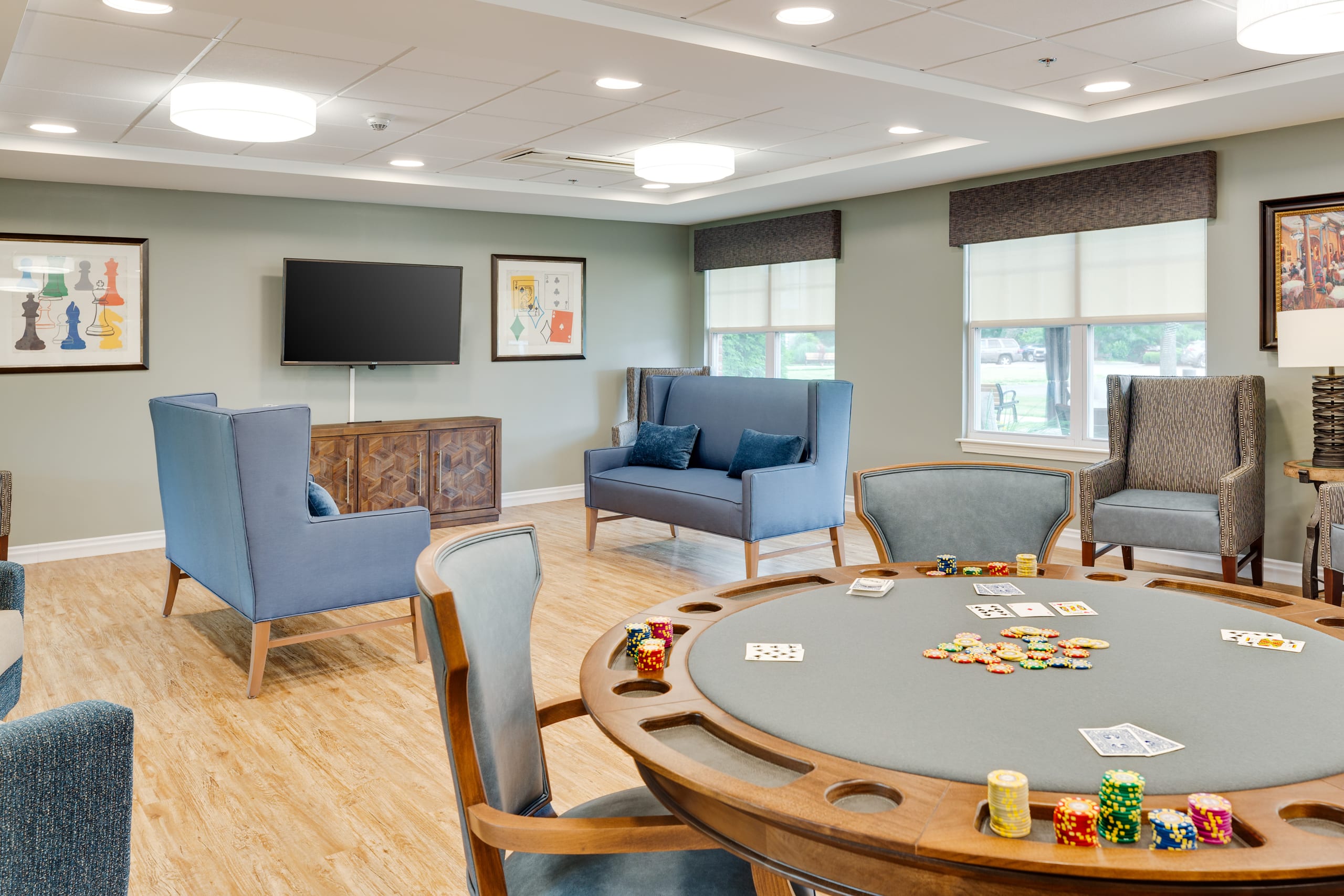 Interior common area with a poker table and seating.