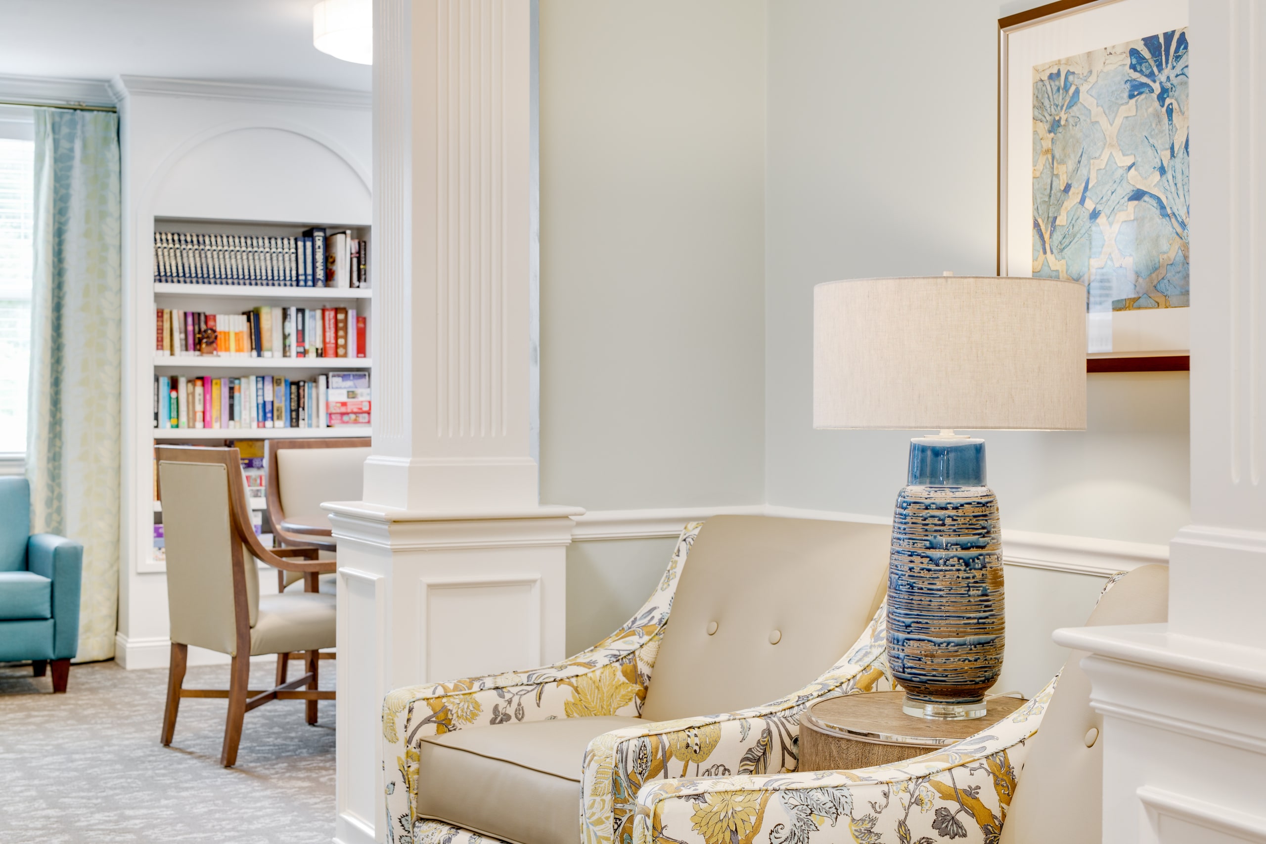 Cozy common area with seating and bookshelves