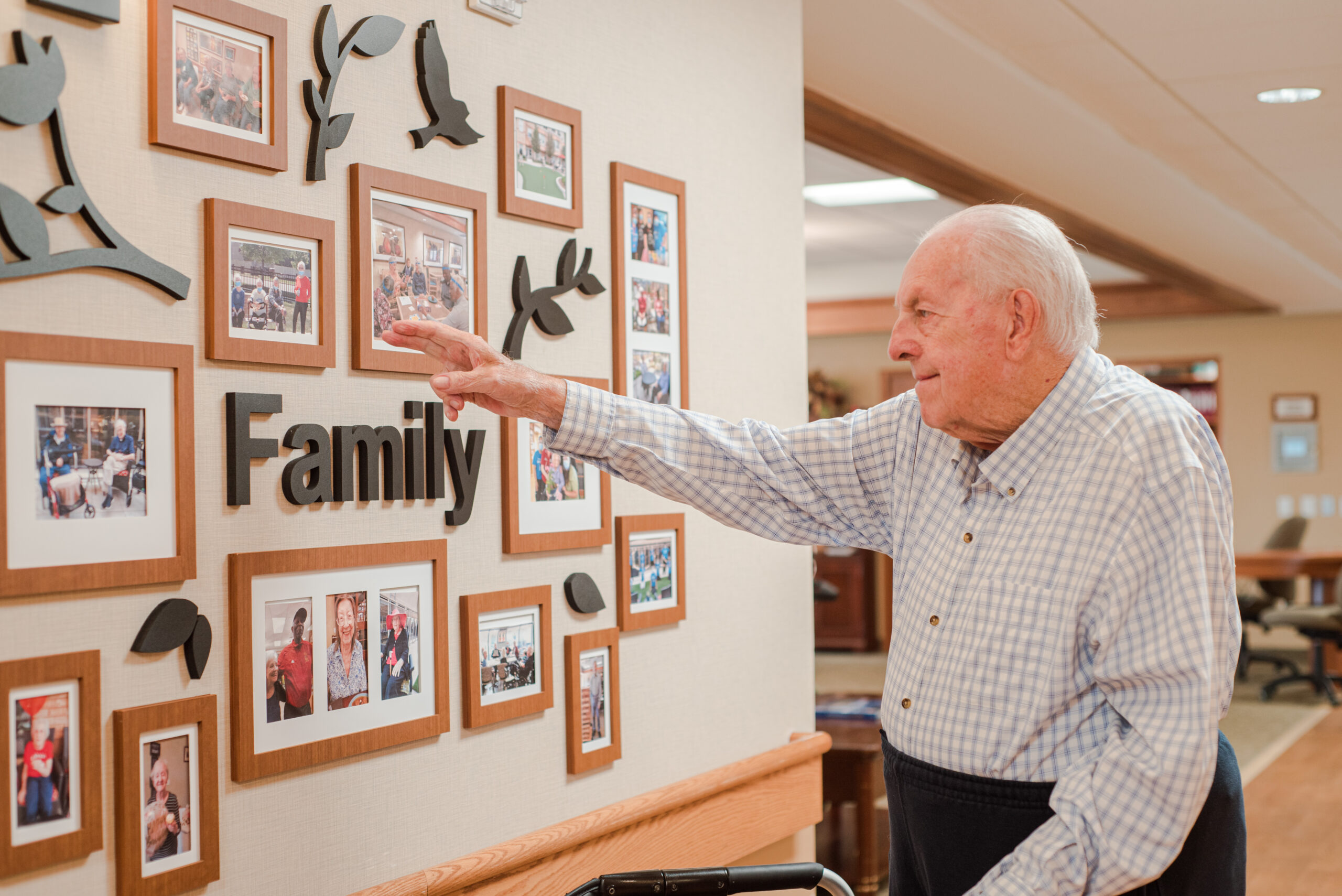Resident engaging with a family photo display