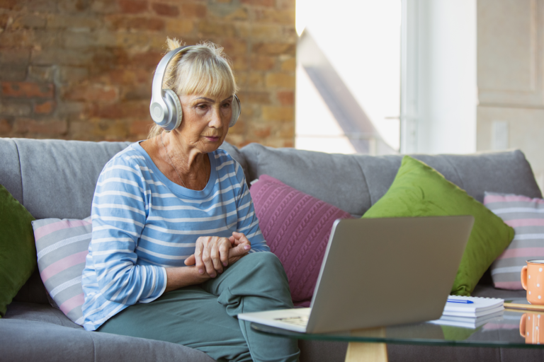 Resident engaging in a virtual activity on a laptop