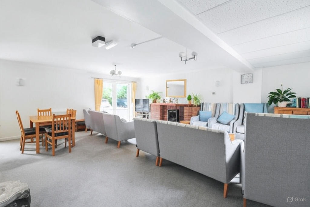 Bright common area with seating and dining space