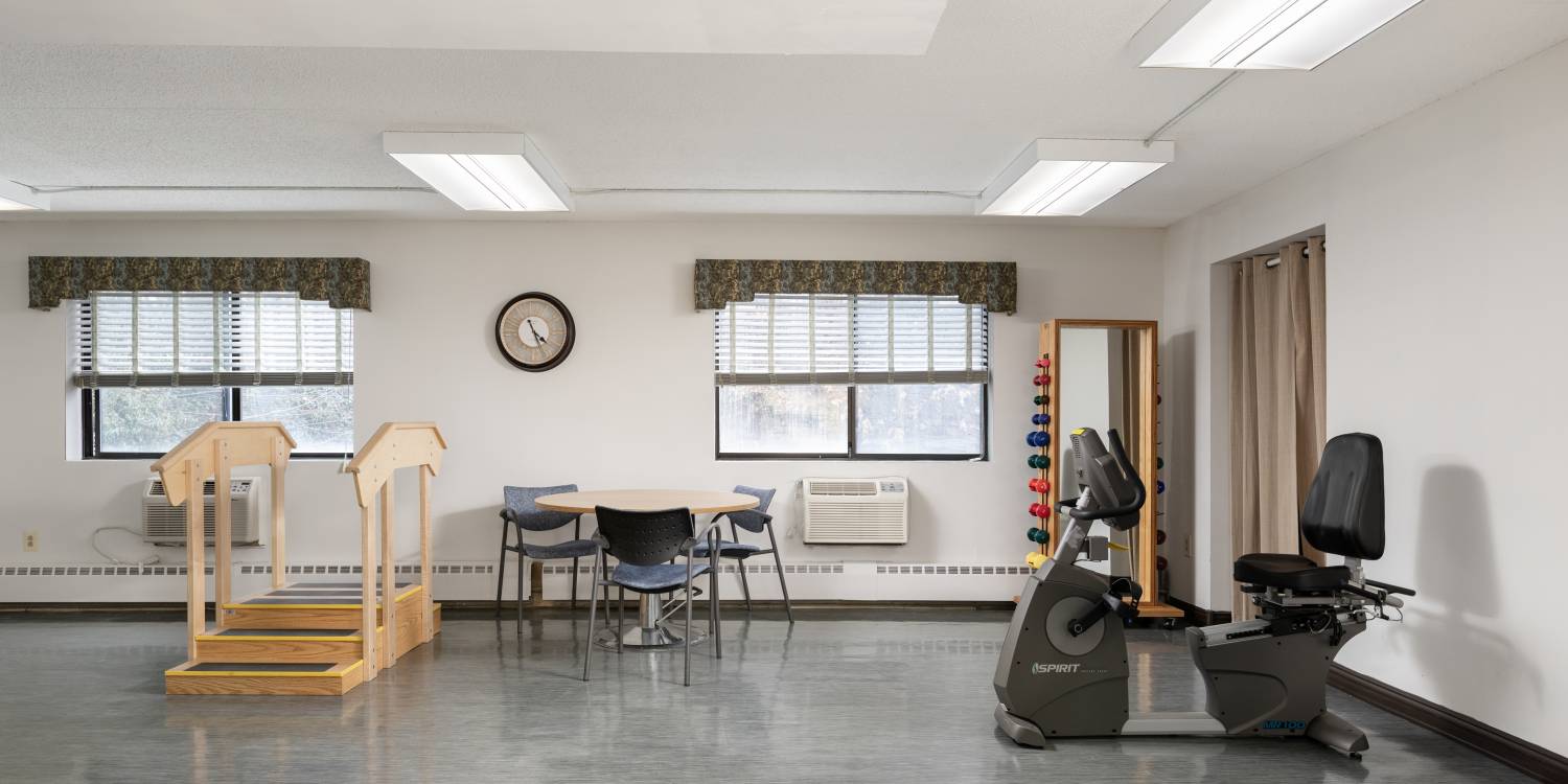 Rehabilitation room with exercise equipment and seating