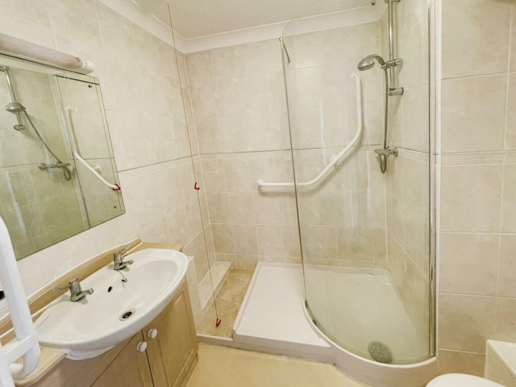 Bright bathroom with modern fixtures and a walk-in shower
