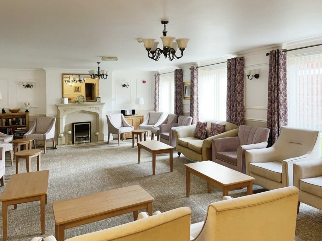 Common lounge area with seating and natural light