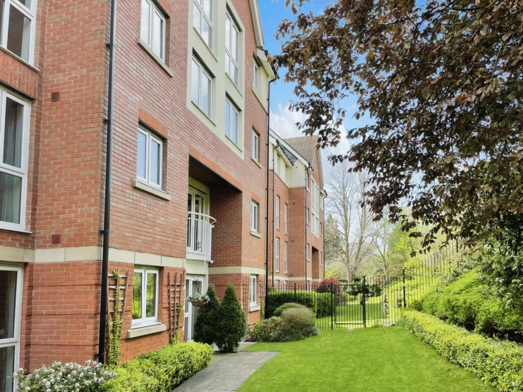 Exterior view of the Highpoint Senior Living building and gardens