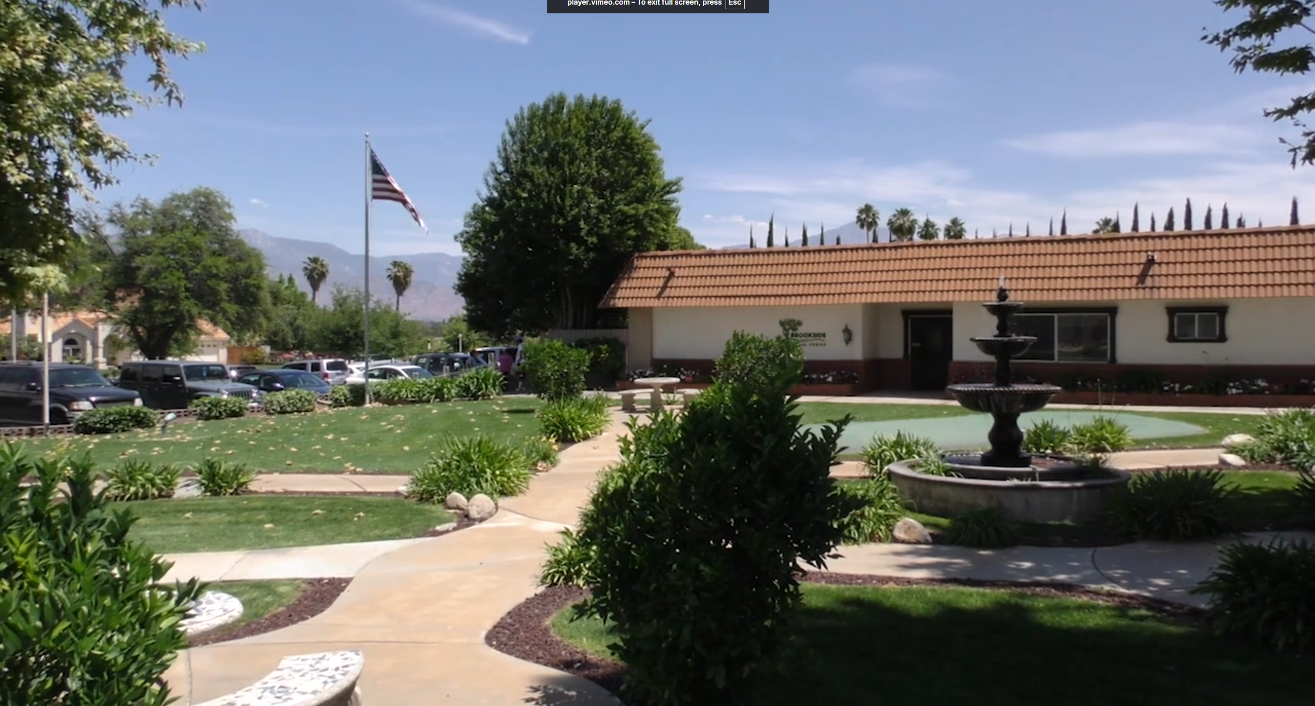 Outdoor view of Brookside Rehabilitation Center with gardens and landscaping