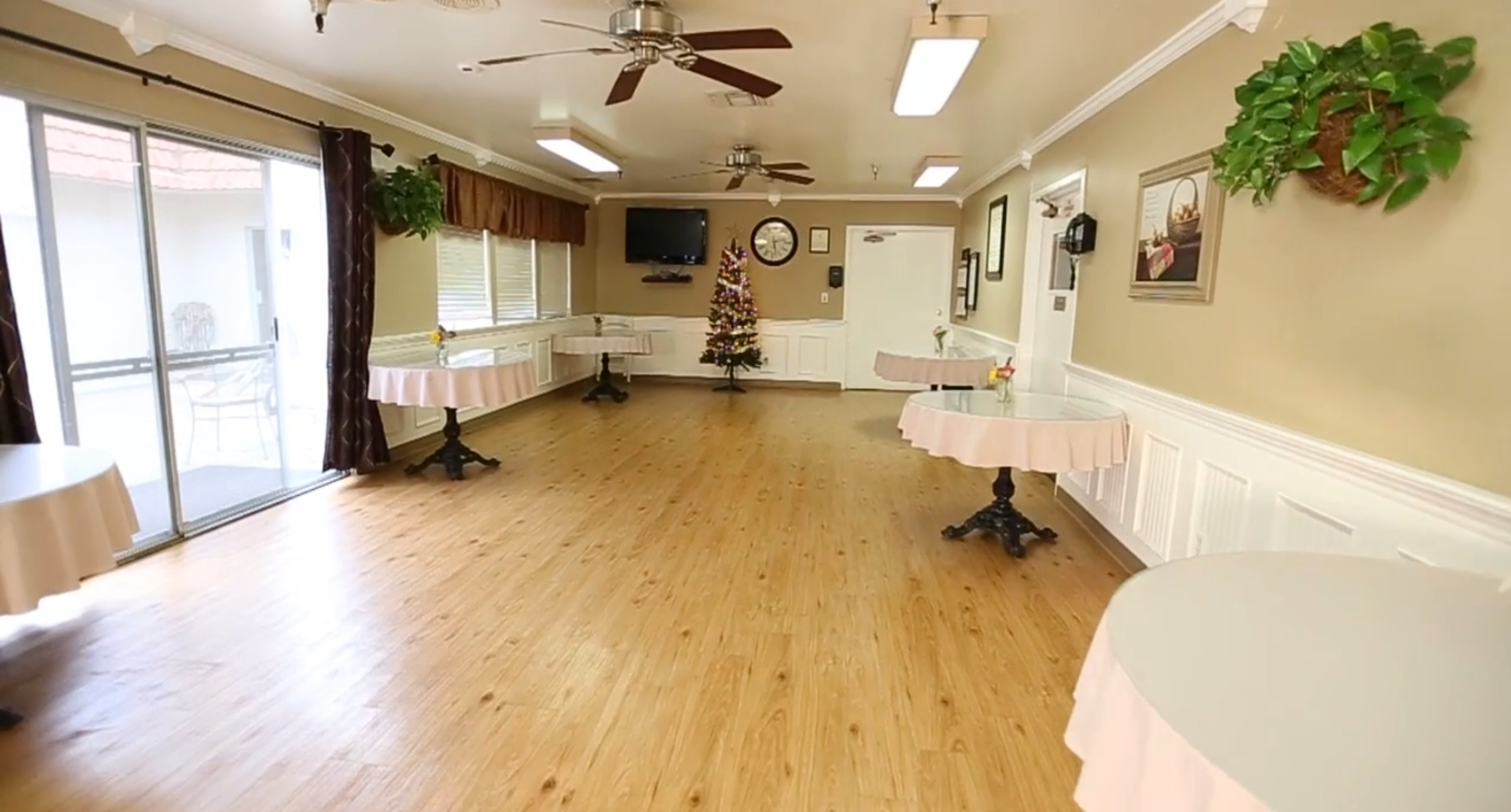Bright interior of a common area with tables and decorations