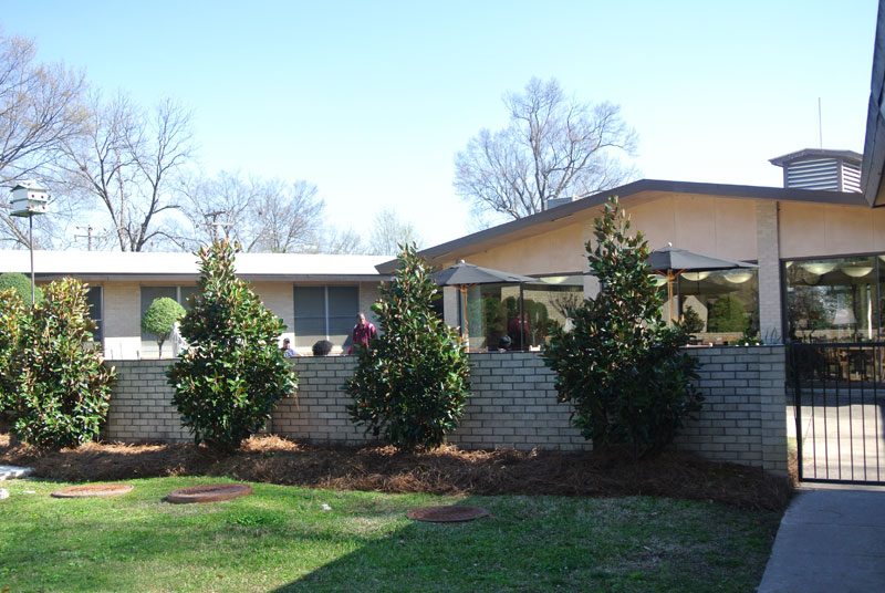 Exterior view of the facility featuring landscaping.