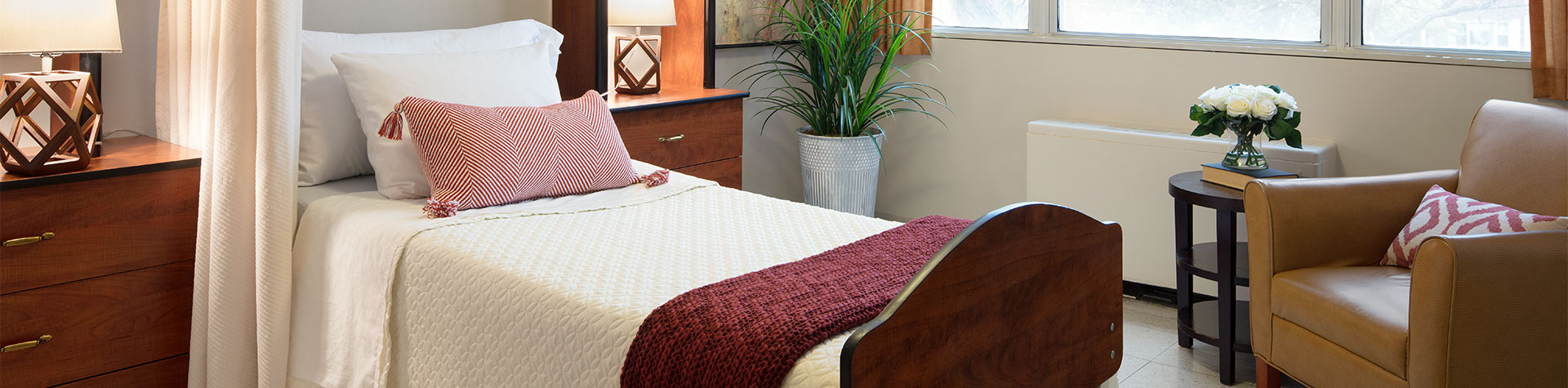 Cozy private resident room with furnishings.