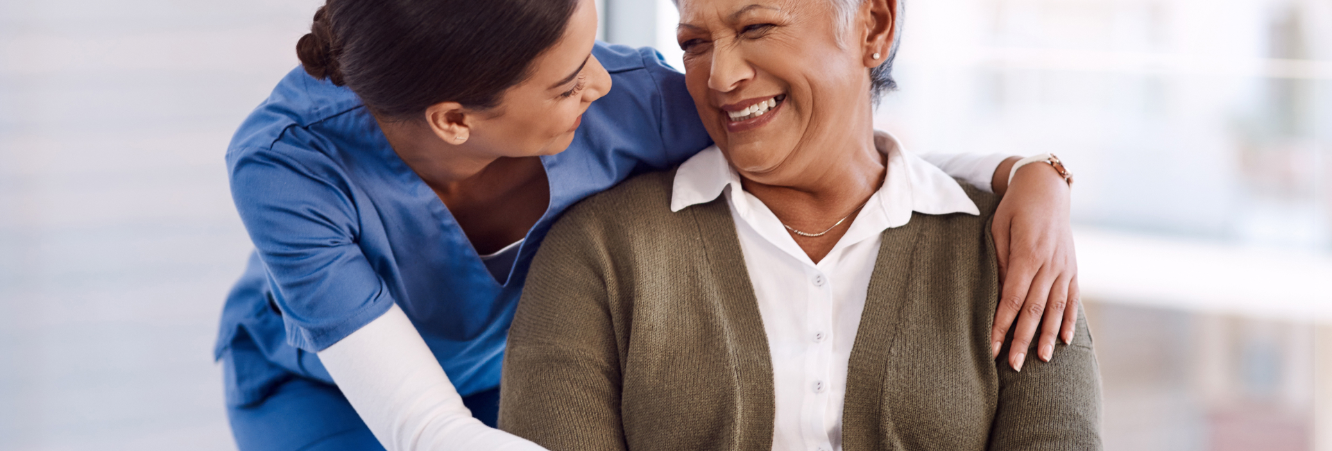 Staff member smiling with a resident