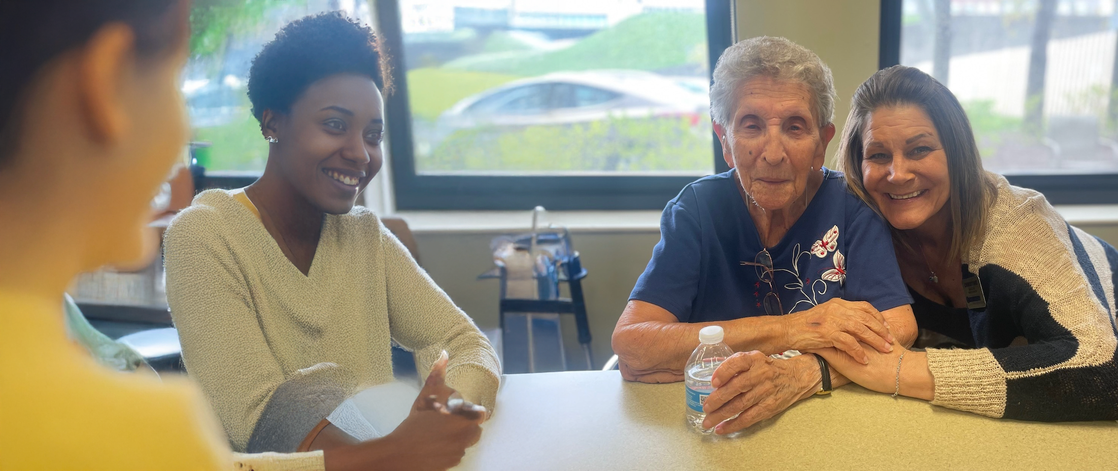 Residents and staff engaging in a conversation