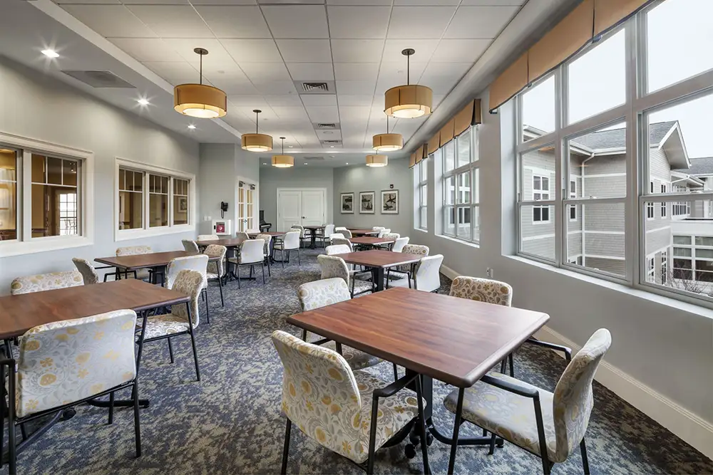 Bright common area with tables and chairs