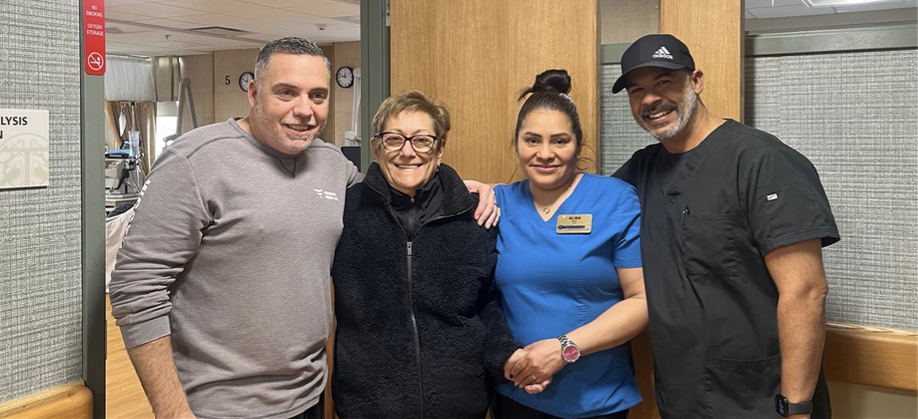 Staff member with resident and two visitors