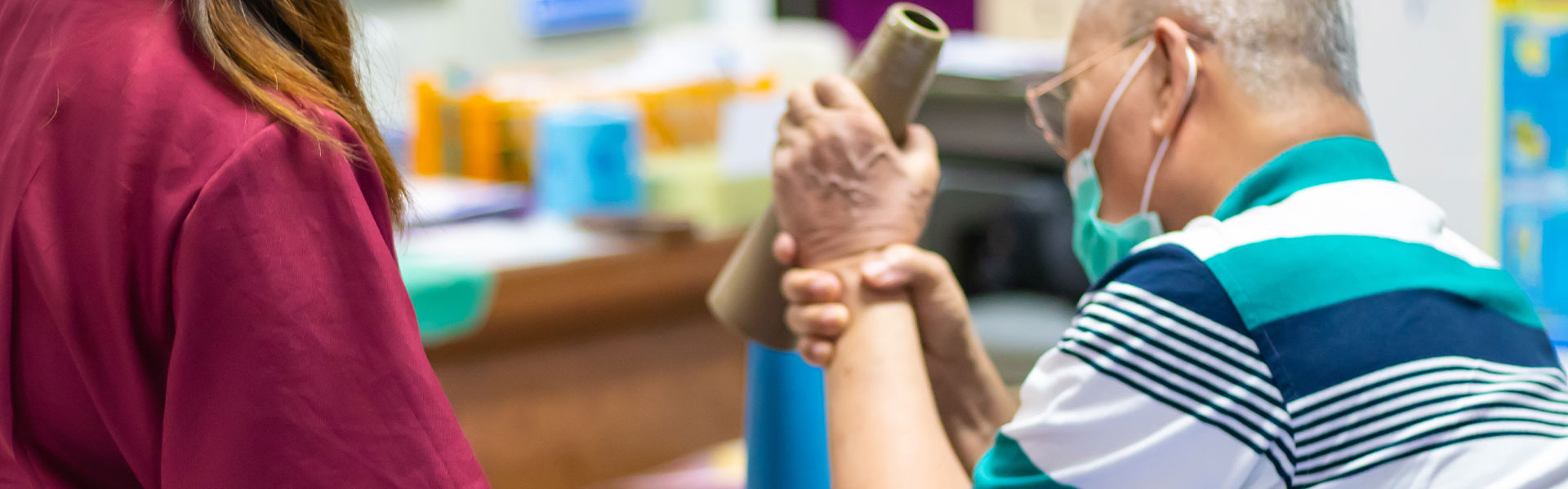 Therapist assisting a resident with an activity