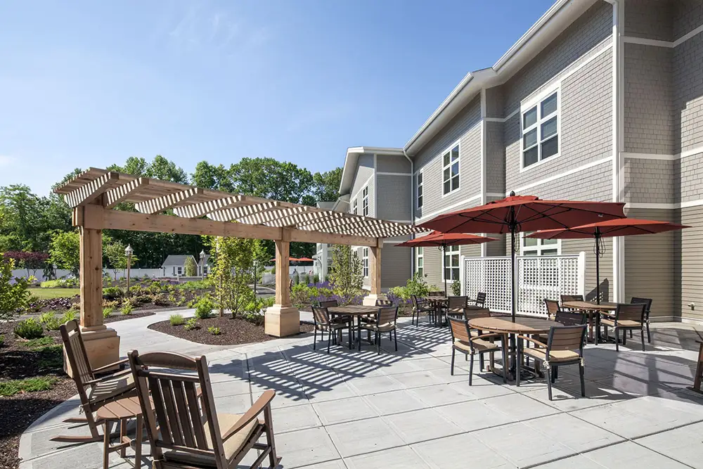 Outdoor patio area with seating and shade structures.