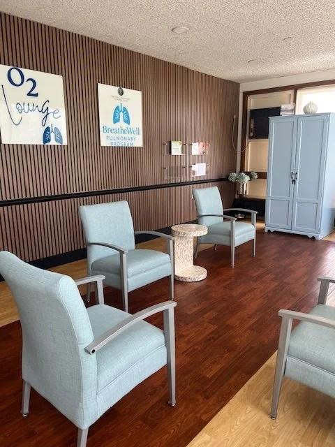Common area with seating and decorative signage.