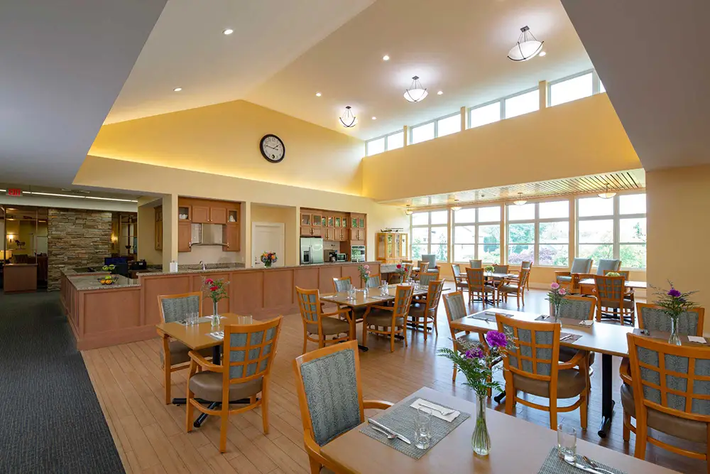 Bright dining area with tables and chairs