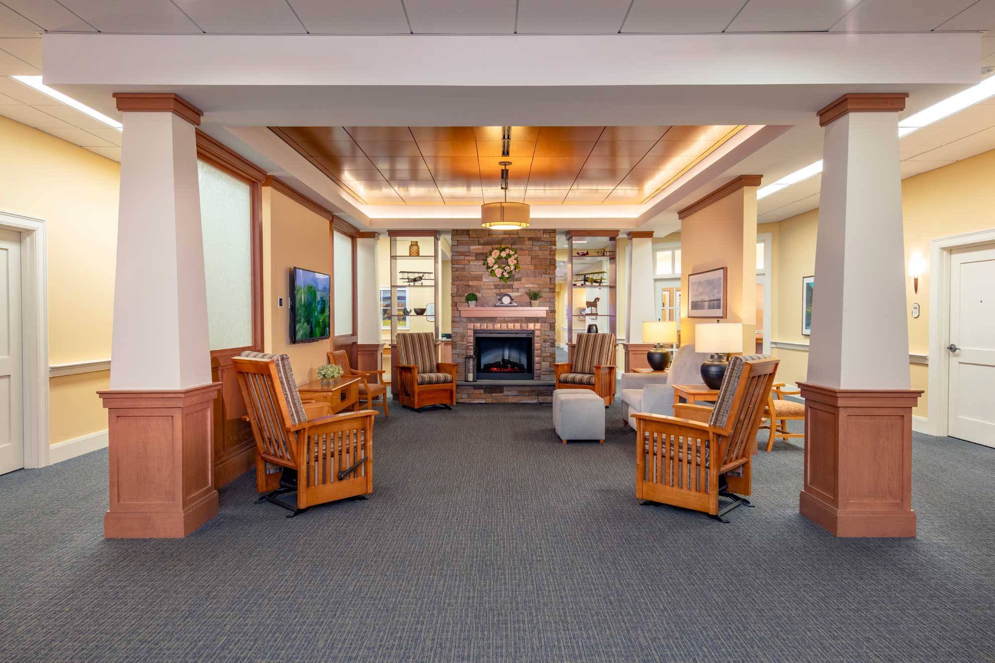 Cozy common area with chairs and fireplace