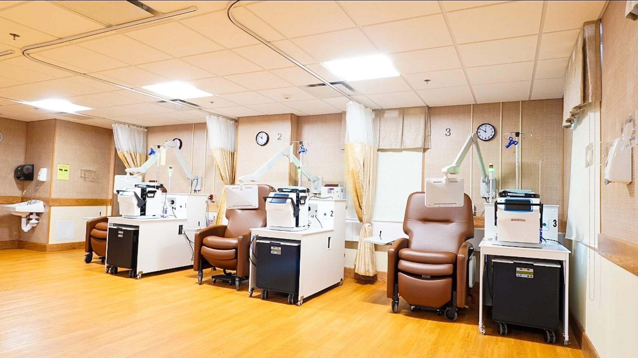 Treatment area with recliners and medical equipment.