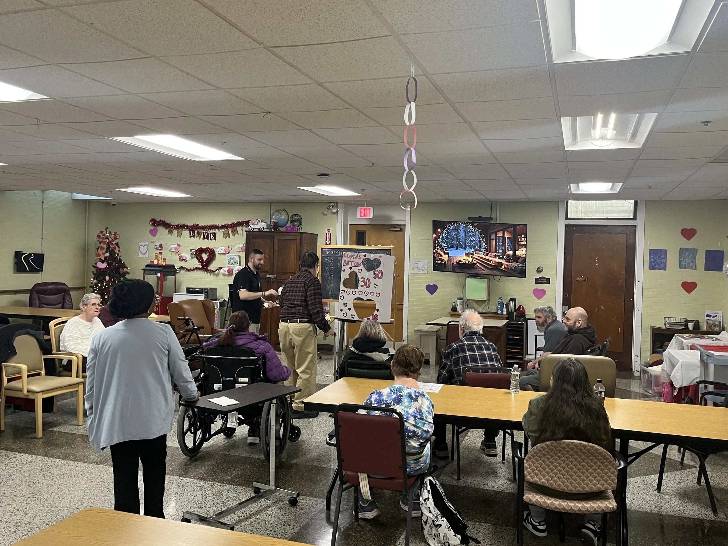 Residents and staff participating in an activity in a common area
