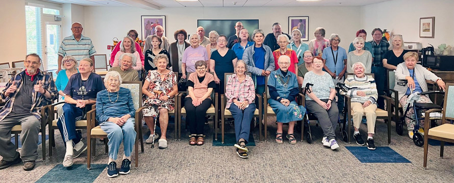 Residents and staff gathering in a common area