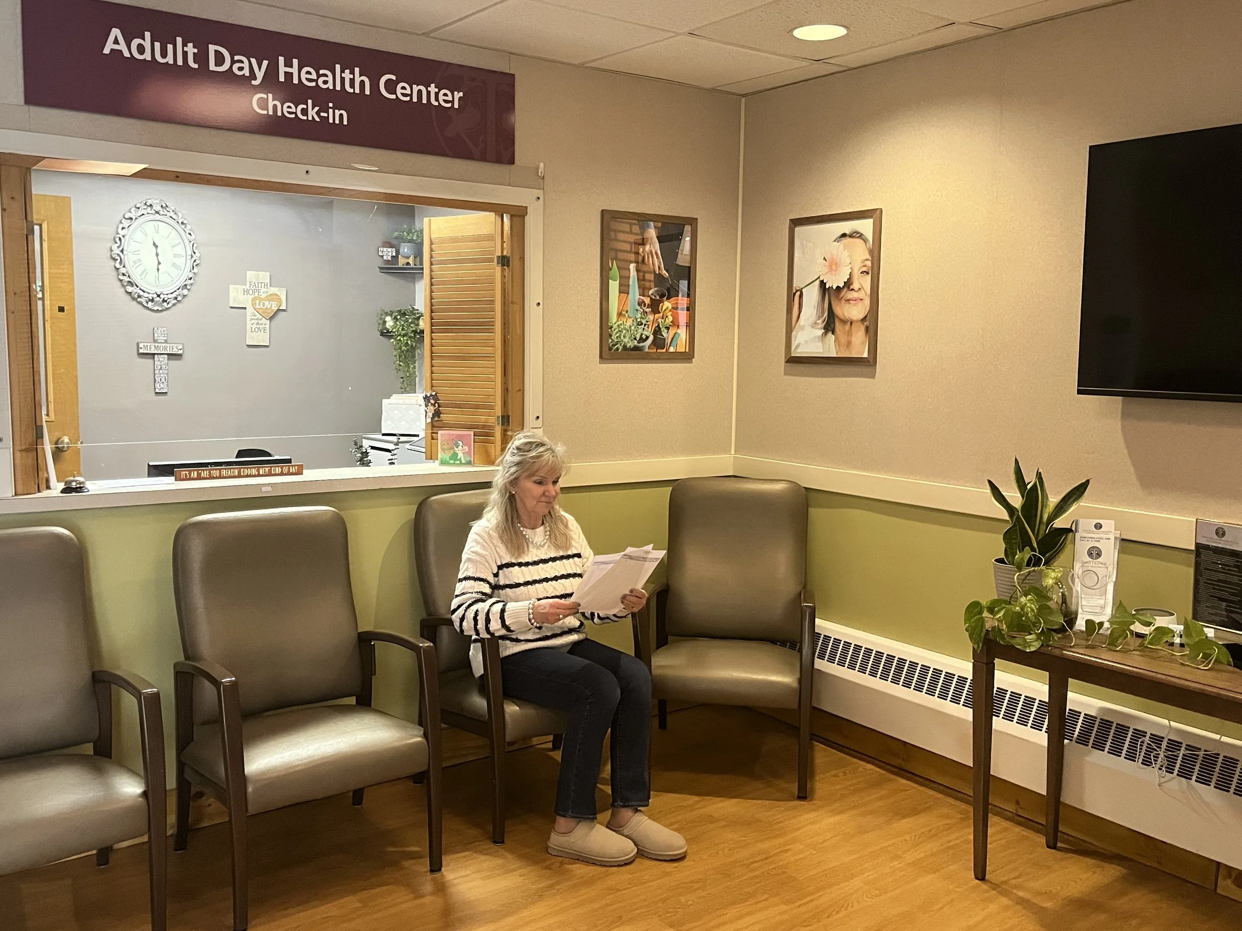 Resident reading in a waiting area