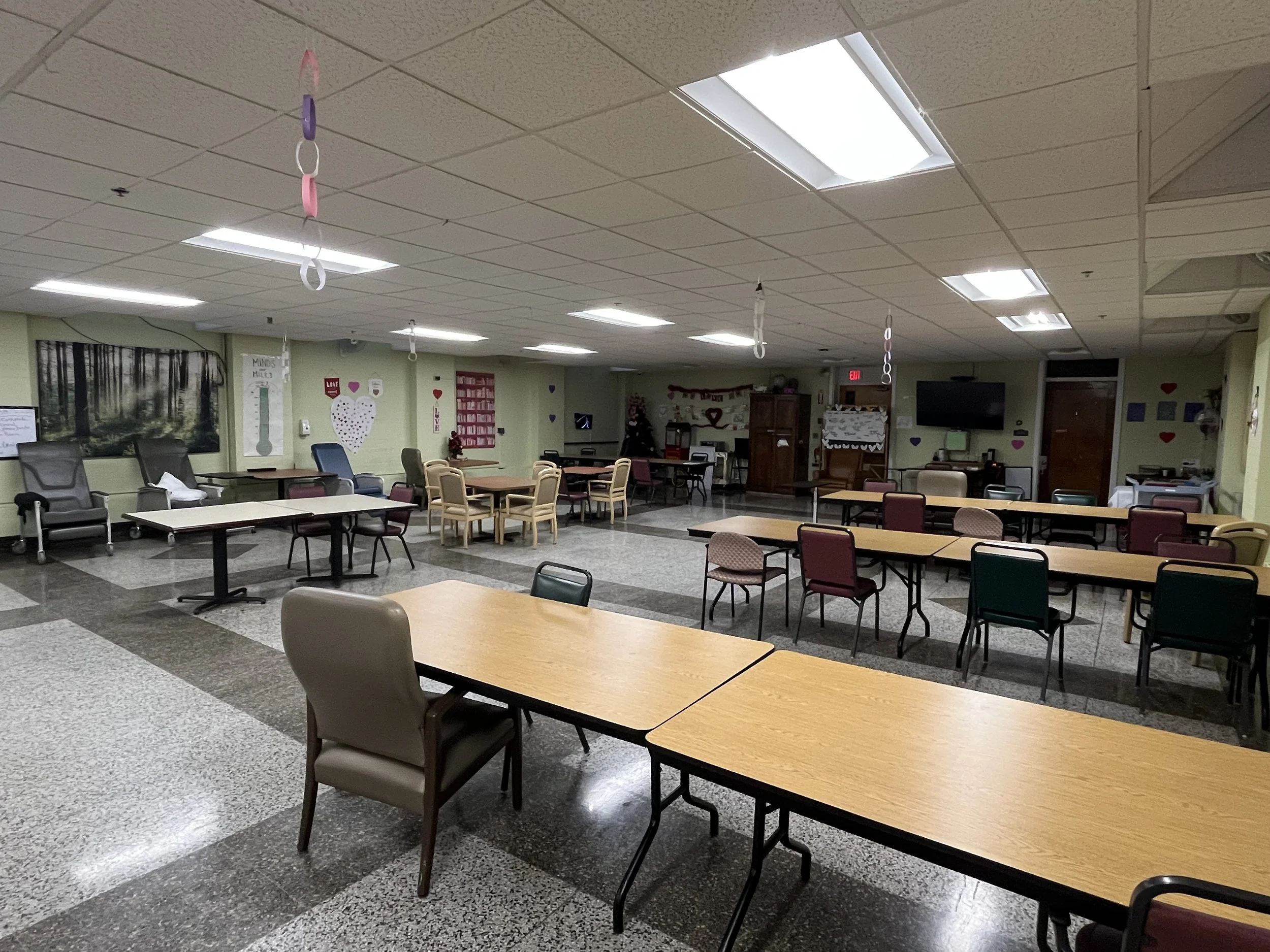 Interior common area with tables and chairs.
