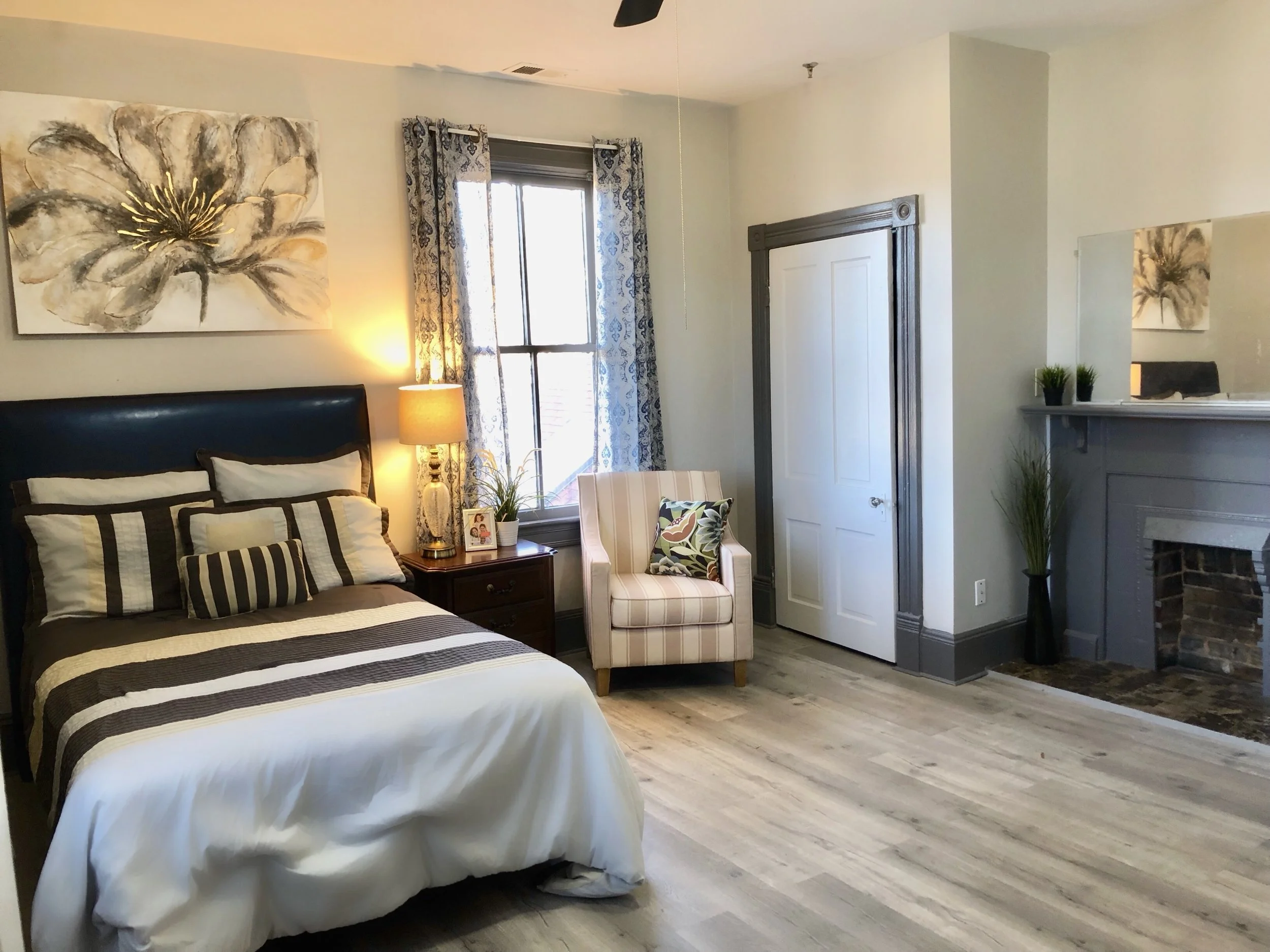 Well-furnished resident room with cozy decor.