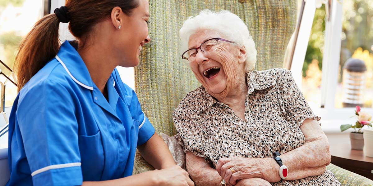 Staff member laughing with a resident