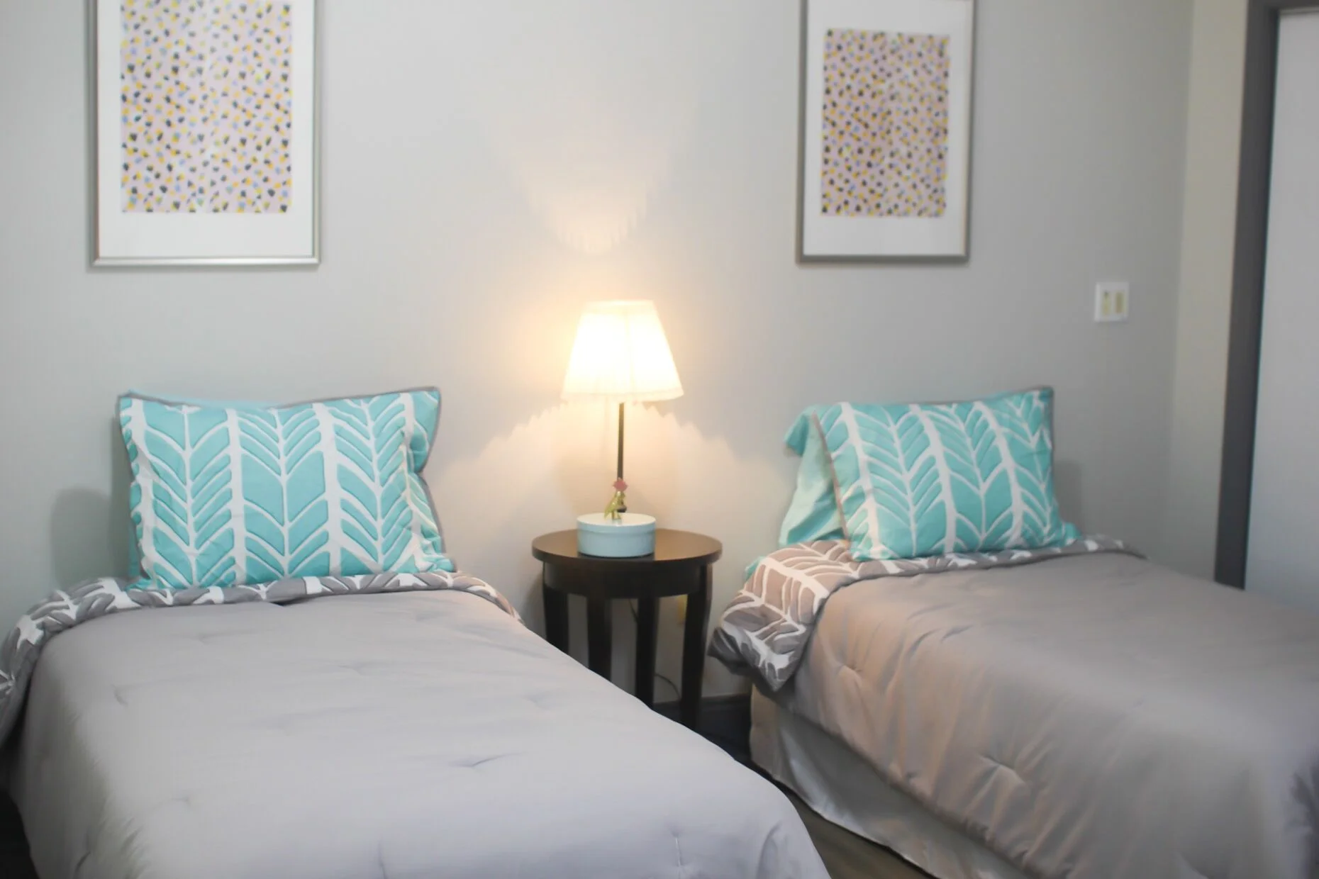 Two twin beds in a cozy room setting.