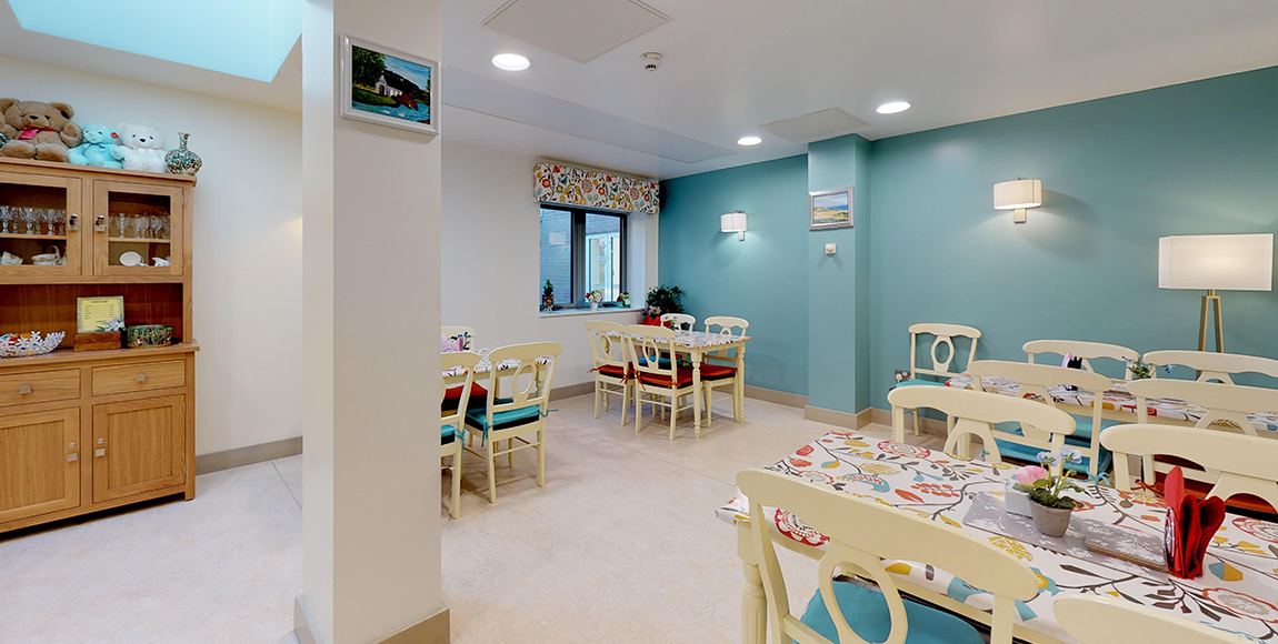 Bright dining area with colorful decor and tables.
