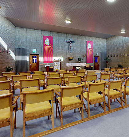 Interior view of a chapel with seating.