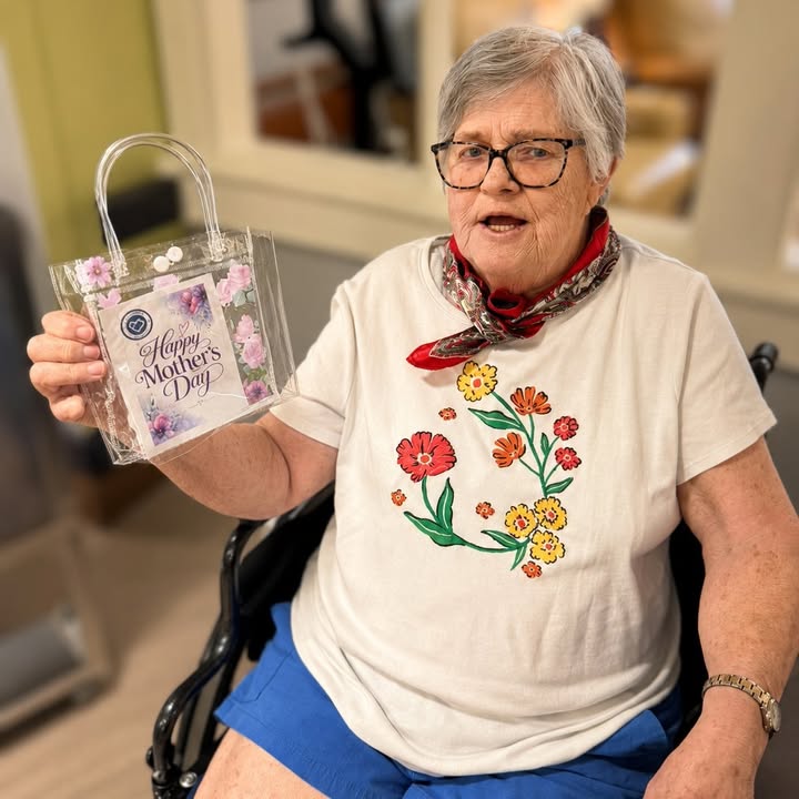 Resident celebrating Mother's Day with a gift bag.