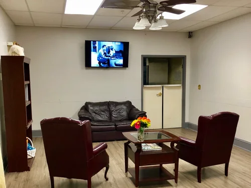 Cozy common area with seating and television.