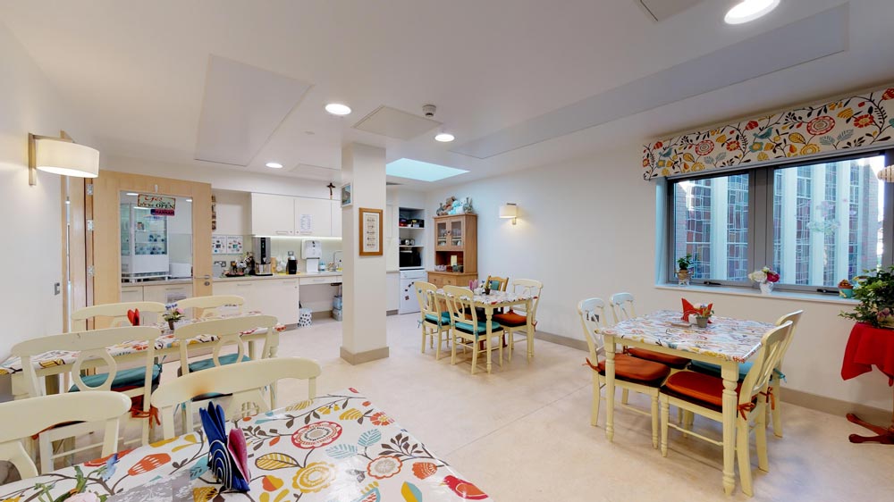 Bright dining area with colorful tables and chairs.