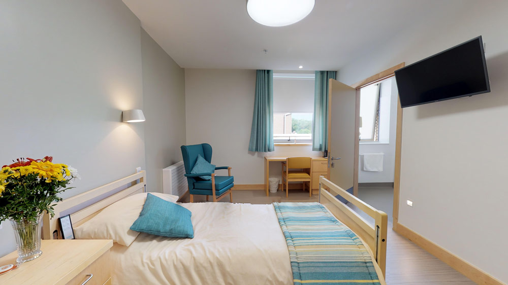 Cozy resident room with bed and seating area