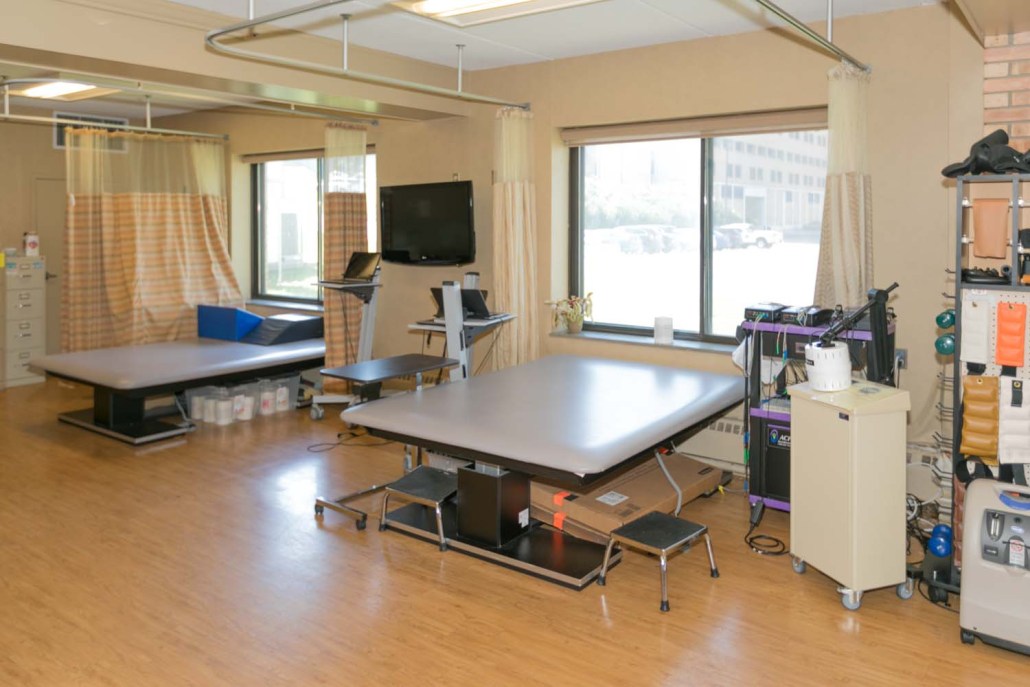 Interior physical therapy room with equipment
