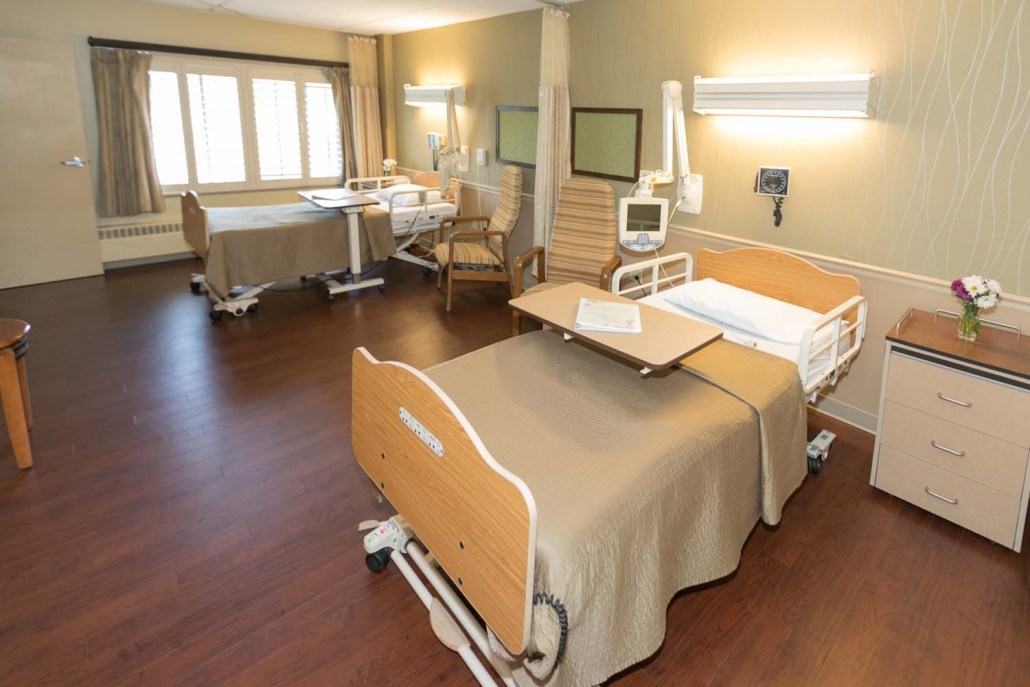 Private resident room with medical bed and furniture