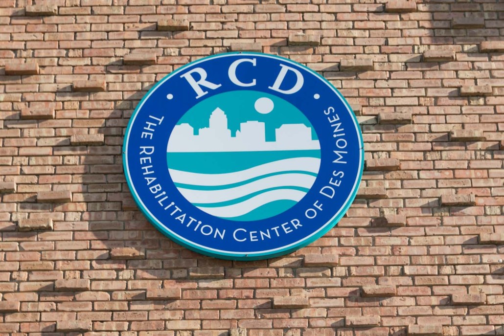 Facility logo on a brick wall