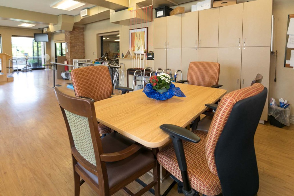 Interior view of a common area with a table and chairs.