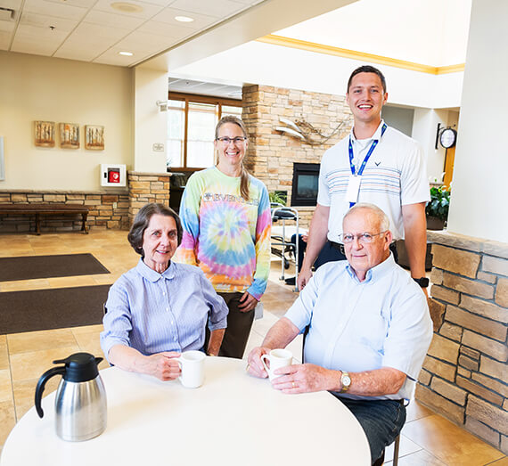Residents and staff enjoying coffee in a common area