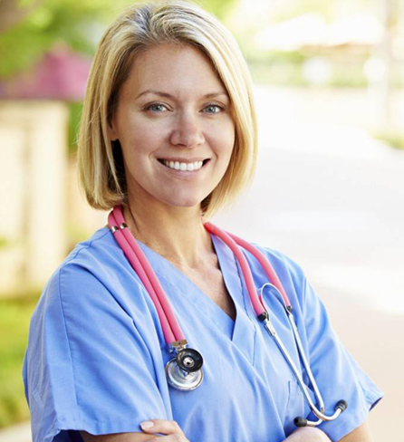 Smiling nurse in scrubs with a stethoscope